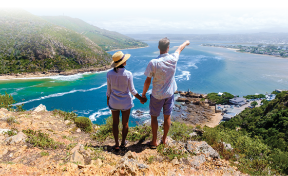 lagoon of Knysna, South Africa. beach in Knysna, Western Cape, South Africa. A couple of men and a woman on a road trip at the garden route in South Africa