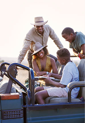 A group of people are riding in a jeep. Description generated by AI