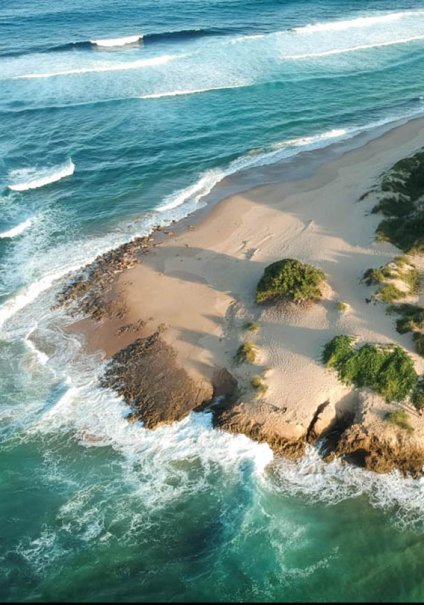 drone shot of a beach on an island in Tofo, Mozambique