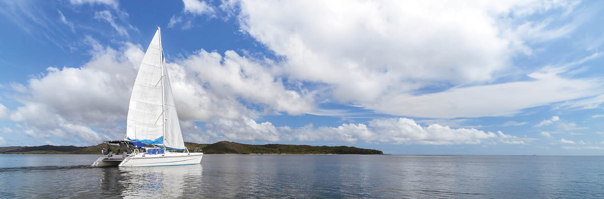 A sailboat is on the water. Description generated by AI