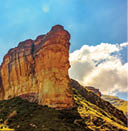 Scenic color panoramic South Africa Drakensberg Golden Gate national park landscape - impressive nature with golden red rock landmark and blue sky and clouds 