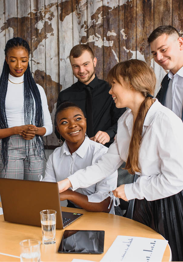 Group of happy young business people in a meeting at modern office. Multi-Ethnic Group Of Business People In Office