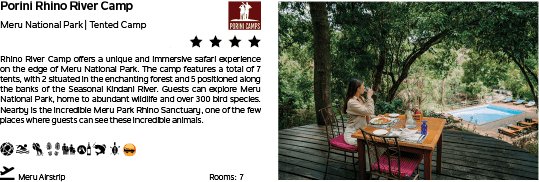 A woman sitting at a table with a blue bottle in front of her. Description generated by AI