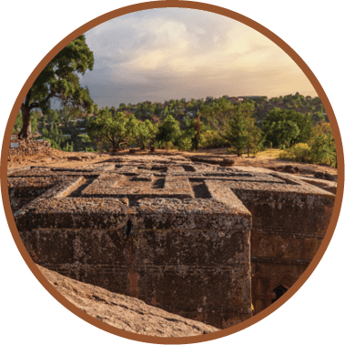 A large stone structure with a cross on it. Description generated by AI