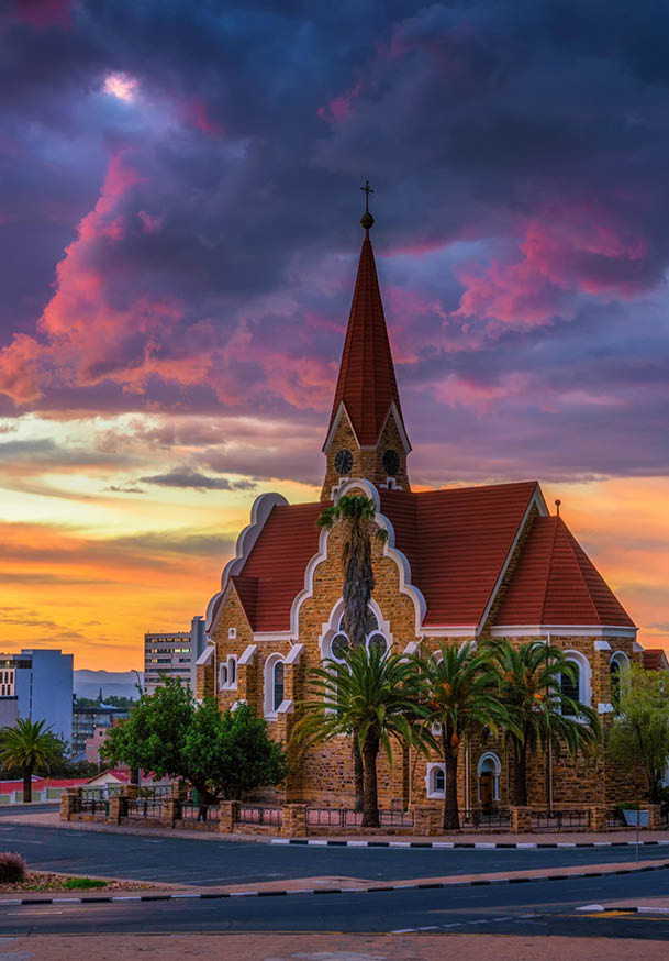 Dramatic sunset above Christchurch, a historic landmark and Lutheran church in Windhoek, capital city of Namibia.