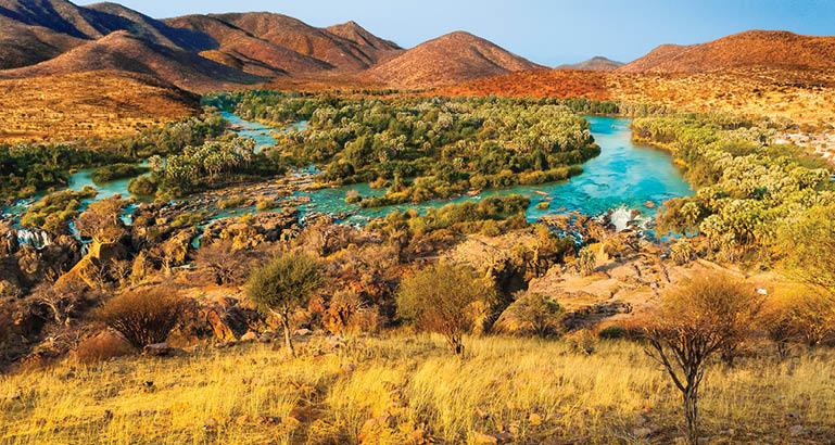 A beautiful landscape with a river running through it. Description generated by AI