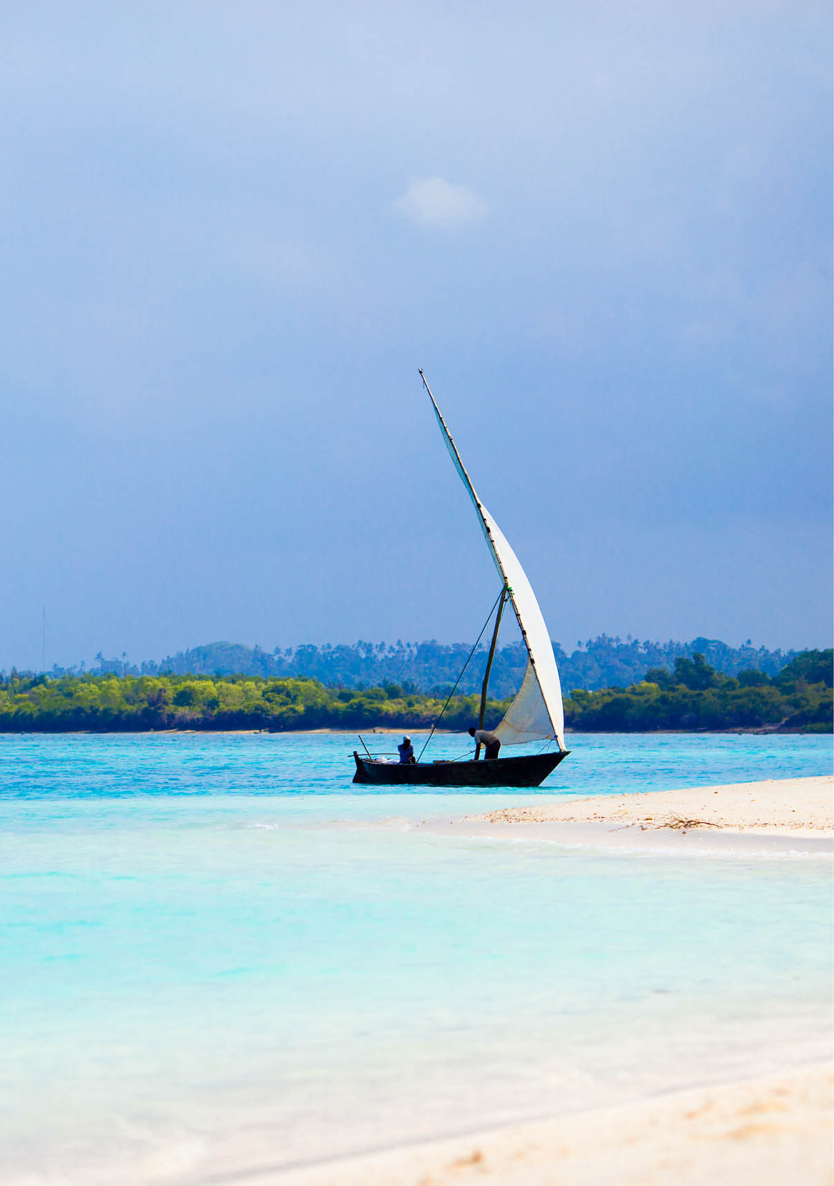 Small wooden boat in stunning turquoise water