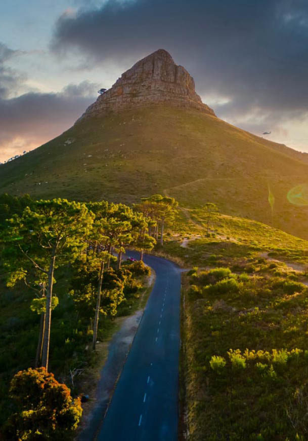 sunset at Signal Hill Cape Town South Africa, sunset with a view at Lions Head and Camps Bay Cape Town. Couple man and woman watching sunset