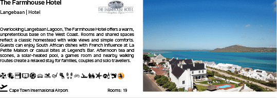 A hotel advertisement with a picture of the hotel and a blue sky. Description generated by AI