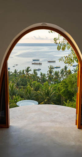 Hotel room coming out on ocean and green jungles below