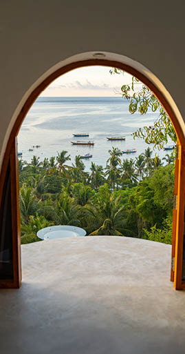 Hotel room coming out on ocean and green jungles below