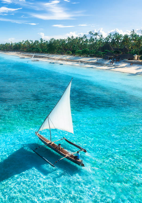 A white sailboat on the water. Description generated by AI