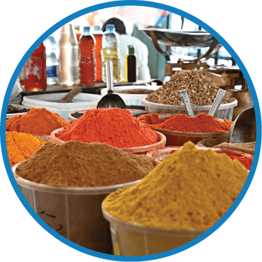A table with many bowls of spices. Description generated by AI