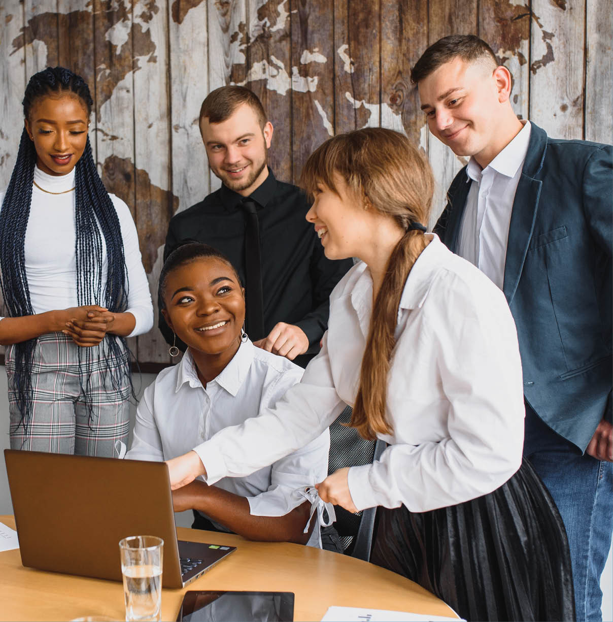 Group of happy young business people in a meeting at modern office. Multi-Ethnic Group Of Business People In Office
